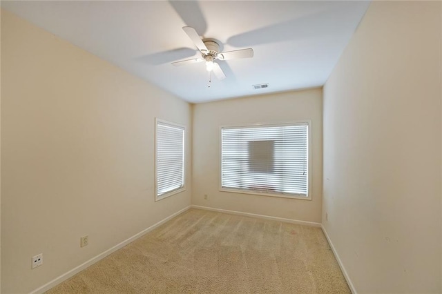 empty room with light carpet and ceiling fan