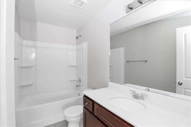 full bathroom with shower / bathing tub combination, vanity, and toilet