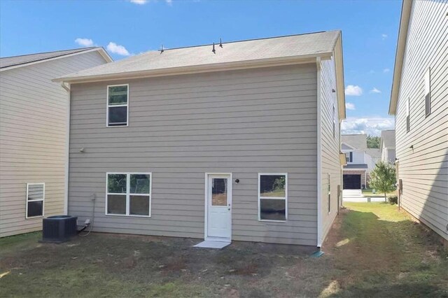 back of property with central AC unit