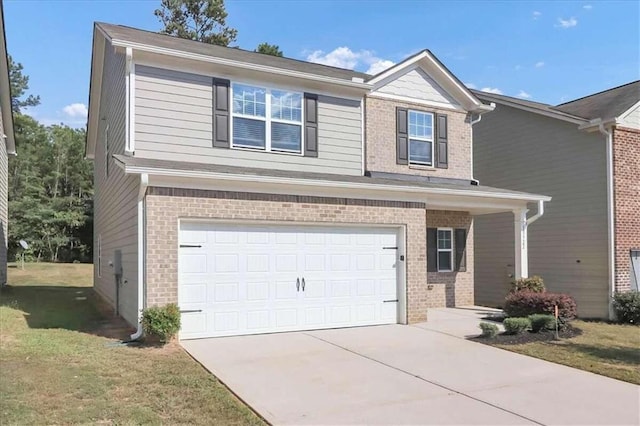 view of front of property with a garage and a front yard