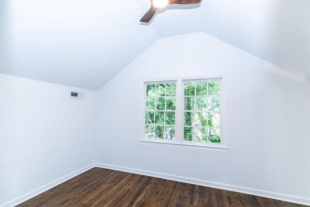 additional living space with ceiling fan, vaulted ceiling, dark wood finished floors, and visible vents
