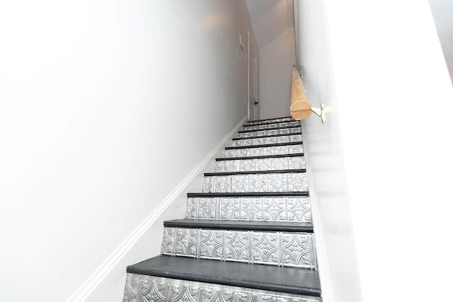 stairs featuring baseboards
