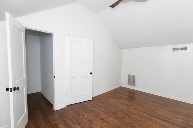 additional living space featuring ceiling fan, lofted ceiling, wood finished floors, and visible vents