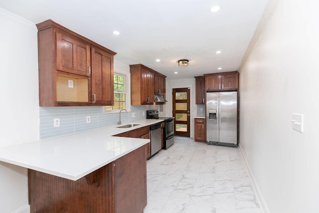 kitchen with a sink, marble finish floor, stainless steel appliances, recessed lighting, and a peninsula