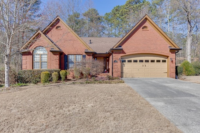 ranch-style home featuring a garage, driveway, a shingled roof, and brick siding