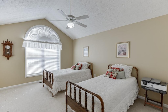 bedroom featuring vaulted ceiling, a textured ceiling, baseboards, and light colored carpet