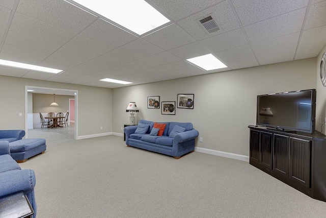 living room featuring carpet, visible vents, and baseboards