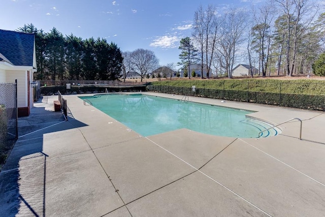 view of pool with a fenced in pool, fence, and a patio