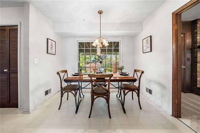 dining space featuring a notable chandelier, visible vents, baseboards, and light floors