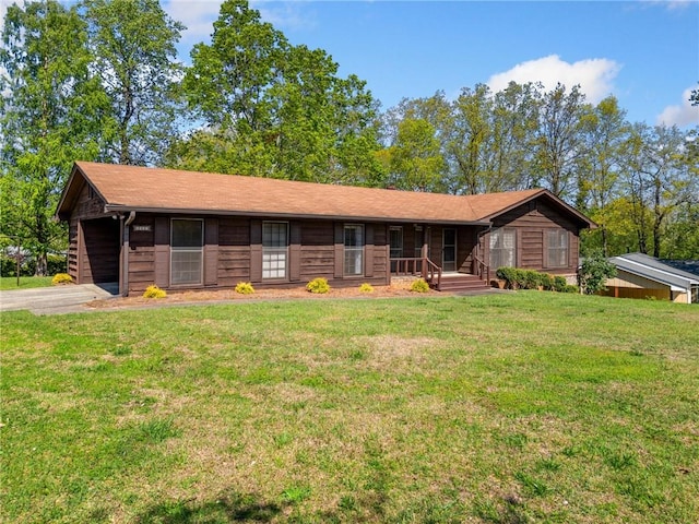 single story home with a front yard and covered porch