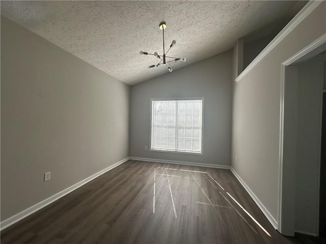 3718 Jackson Bluff Dr, Lawrenceville, GA 30044 - unfurnished room featuring a chandelier, dark wood finished floors, a textured ceiling, and lofted ceiling