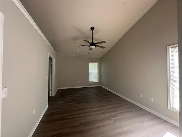 3718 Jackson Bluff Dr, Lawrenceville, GA 30044 - empty room with a ceiling fan, dark wood-type flooring, vaulted ceiling, and crown molding