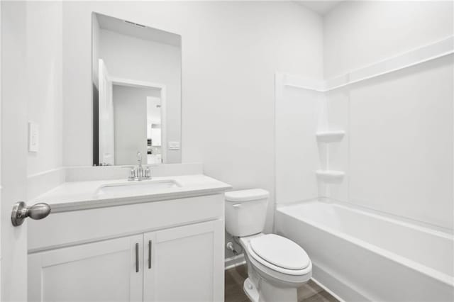 full bath with wood finished floors, toilet, shower / bath combination, and vanity