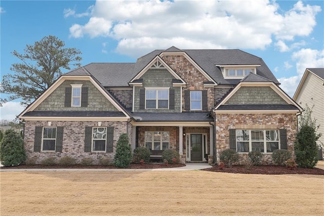 craftsman-style house with a front yard