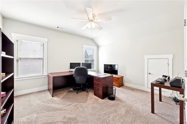 home office featuring light colored carpet, a ceiling fan, visible vents, and baseboards