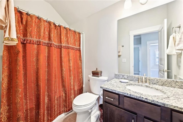 full bathroom with vanity, a shower with shower curtain, tile patterned flooring, vaulted ceiling, and toilet