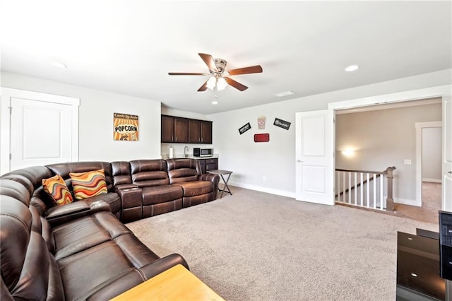 living room featuring recessed lighting, a ceiling fan, baseboards, and carpet floors