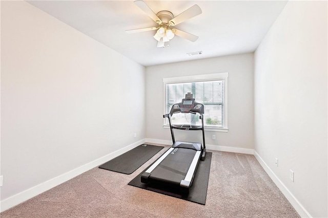 workout area with visible vents, carpet floors, baseboards, and ceiling fan