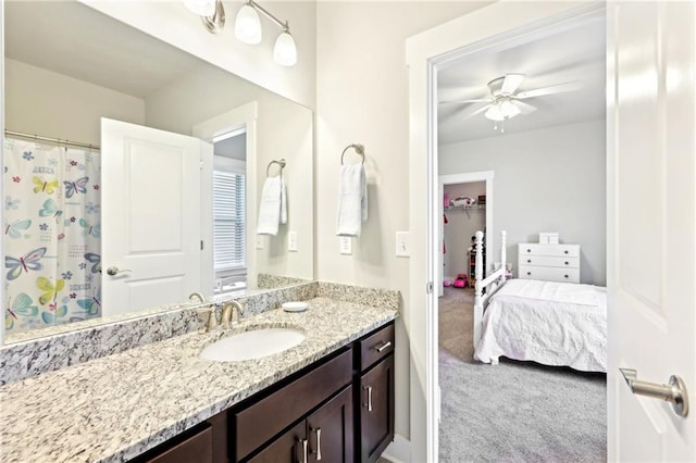 full bathroom featuring ceiling fan and vanity