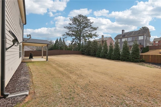 view of yard featuring a patio and a fenced backyard