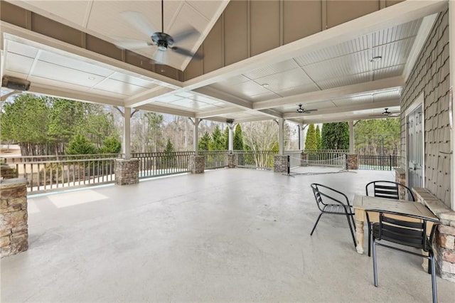 view of patio / terrace featuring ceiling fan, outdoor dining space, and fence