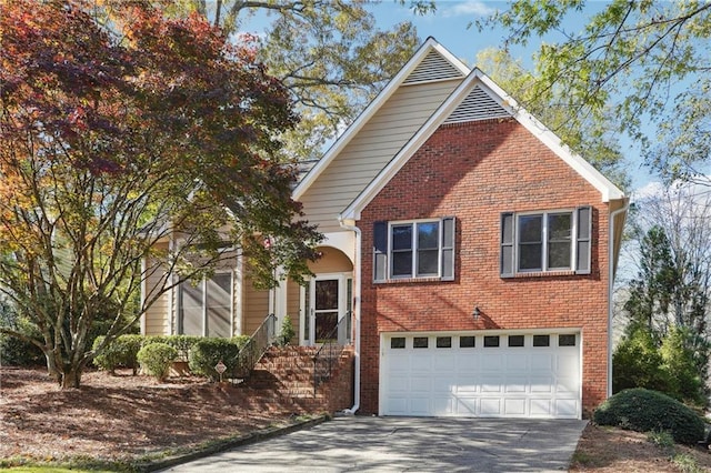 view of front of house featuring a garage, driveway, and brick siding