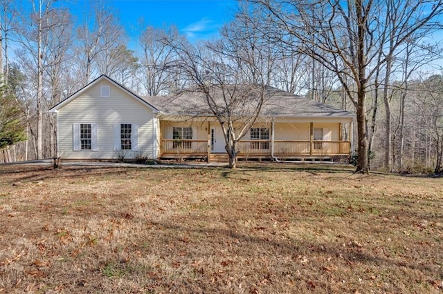 single story home with covered porch and a front lawn