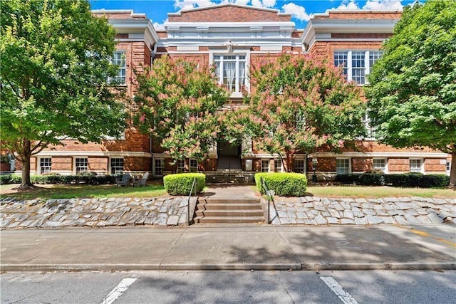 view of front of property featuring brick siding