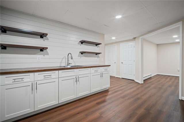 405 Sable Ct, Milton, GA 30004 - kitchen with open shelves, wooden counters, a baseboard heating unit, dark wood-style flooring, and white cabinetry