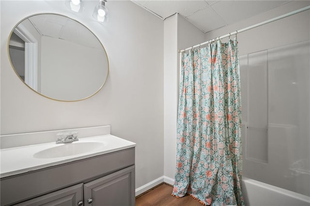 405 Sable Ct, Milton, GA 30004 - bathroom featuring vanity, shower / bathtub combination with curtain, and wood finished floors