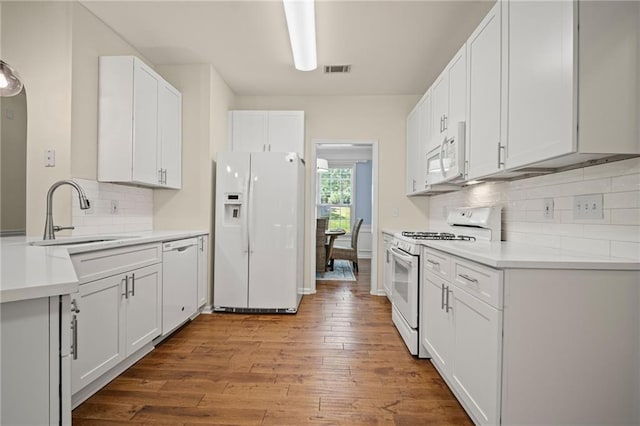 405 Sable Ct, Milton, GA 30004 - kitchen with white appliances, hardwood / wood-style floors, decorative backsplash, white cabinets, and light countertops