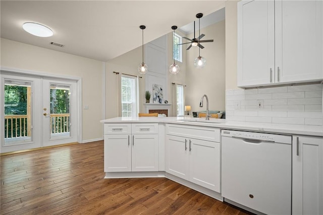 405 Sable Ct, Milton, GA 30004 - kitchen featuring white dishwasher, a peninsula, ceiling fan, dark wood-style floors, and light countertops