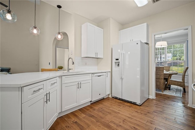 405 Sable Ct, Milton, GA 30004 - kitchen with white appliances, wood finished floors, white cabinetry, and a peninsula
