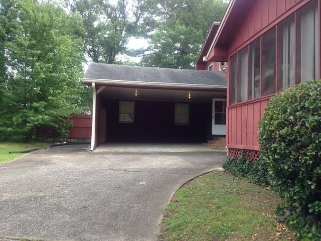 exterior space featuring a carport