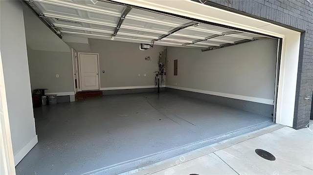 garage featuring electric panel and a garage door opener