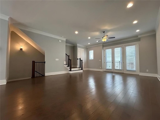 unfurnished living room featuring dark hardwood / wood-style flooring, ceiling fan, and ornamental molding