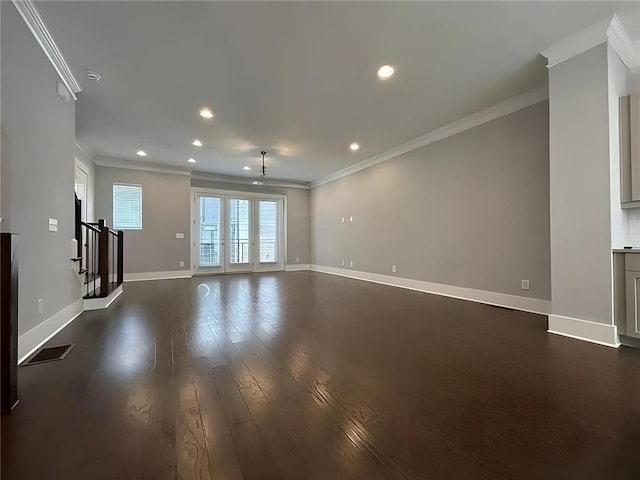 unfurnished living room with crown molding and dark hardwood / wood-style floors