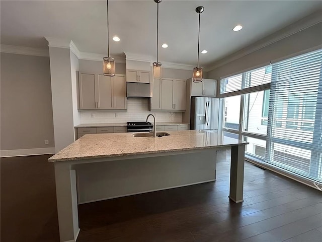 kitchen featuring gray cabinetry, light stone countertops, sink, stainless steel refrigerator with ice dispenser, and decorative light fixtures