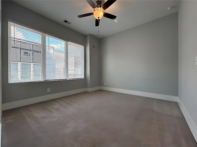 unfurnished room featuring carpet flooring, ceiling fan, and a healthy amount of sunlight