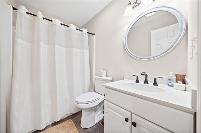 bathroom featuring toilet, tile patterned floors, and vanity