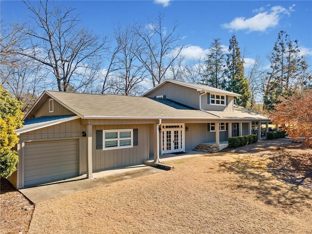 view of front of property with french doors and a garage