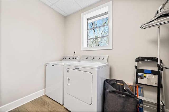 washroom featuring light hardwood / wood-style floors and independent washer and dryer