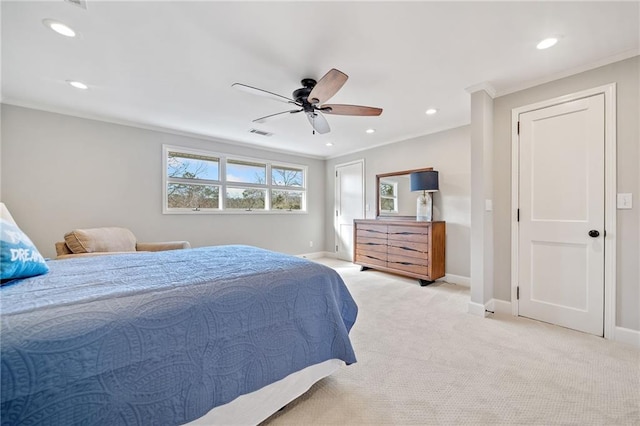 carpeted bedroom with ceiling fan and crown molding