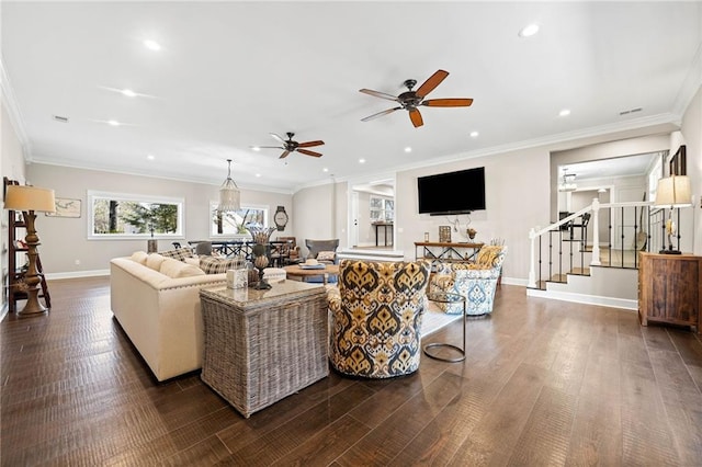 living room with ceiling fan, crown molding, and dark wood-type flooring