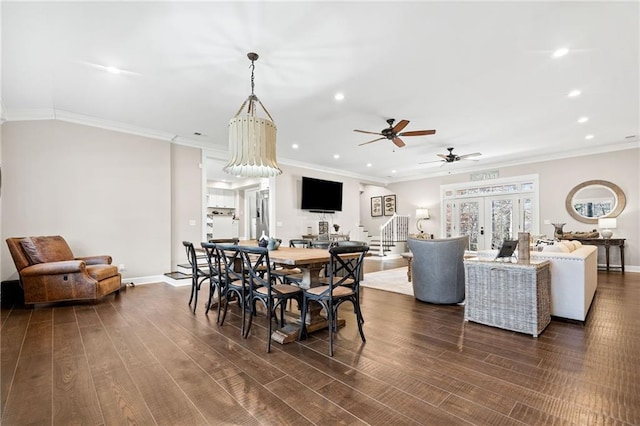 dining space with ceiling fan, crown molding, and dark hardwood / wood-style floors