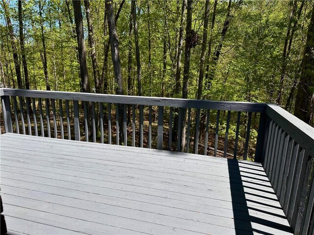 225 Austin Oaks Dr SE, Ellenwood, GA 30294 - wooden deck with a wooded view