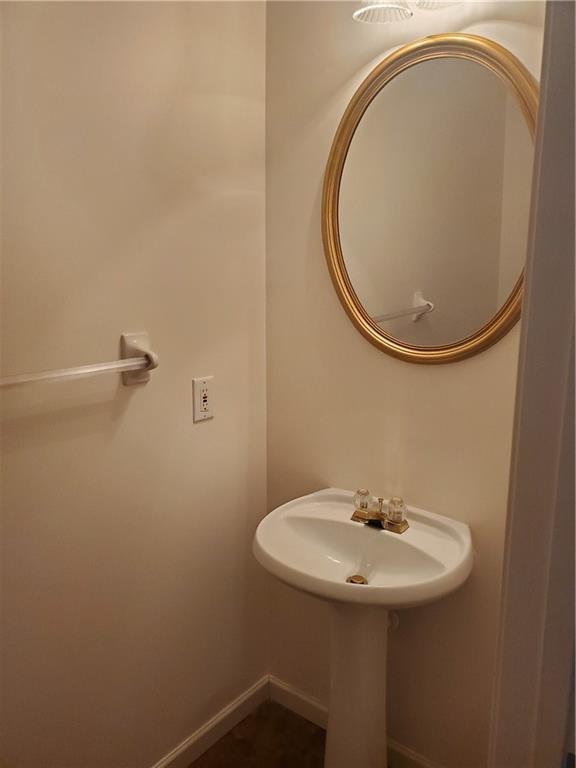 4217 Mill Grove Ln SW, Smyrna, GA 30082 - bathroom featuring baseboards