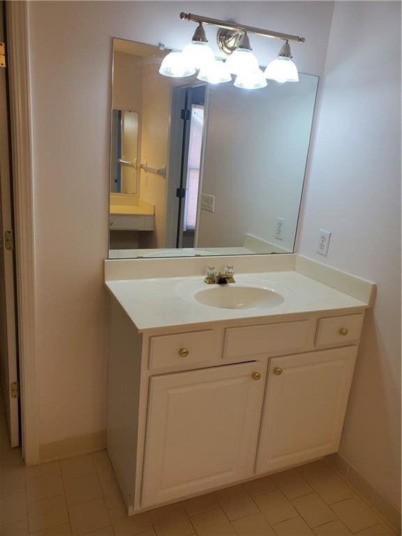 4217 Mill Grove Ln SW, Smyrna, GA 30082 - bathroom with tile patterned floors, baseboards, vanity, and a chandelier