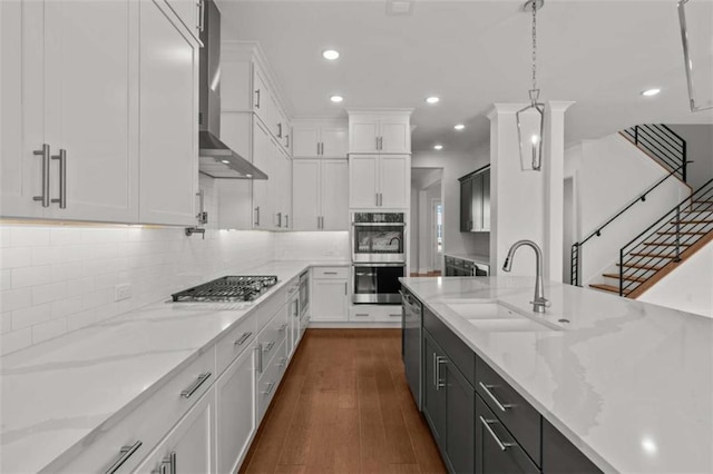 2023 Fern Mountain Ln, Marietta, GA 30064 - kitchen featuring stainless steel appliances, a sink, white cabinetry, wall chimney range hood, and dark cabinets