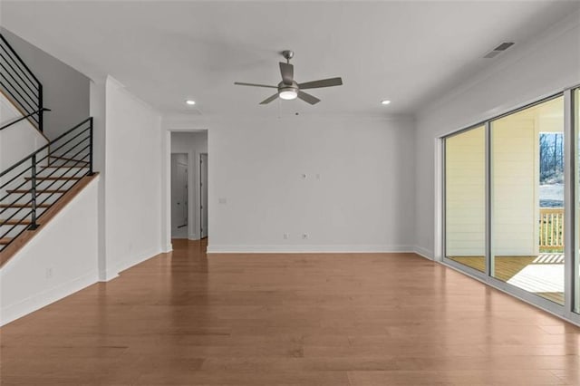 2023 Fern Mountain Ln, Marietta, GA 30064 - unfurnished living room featuring recessed lighting, wood finished floors, visible vents, a ceiling fan, and stairs